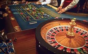 Mobile phone displaying live football match and casino games interface